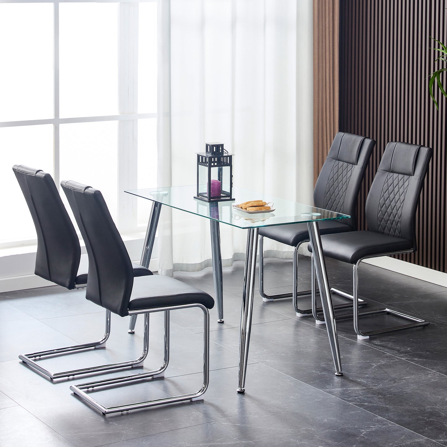 Modern black faux leather dining chairs with chrome cantilever bases