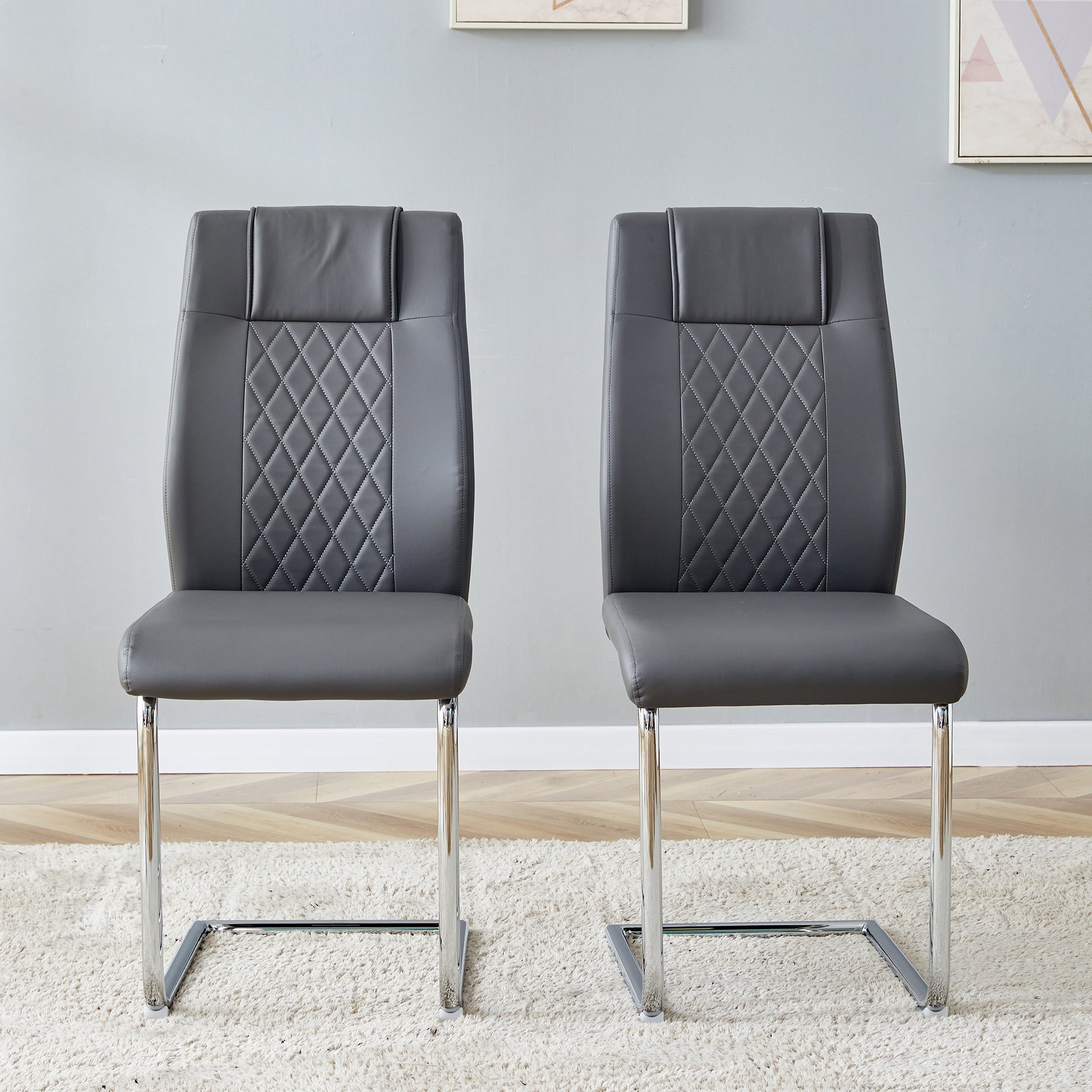Grey faux leather dining chairs with diamond stitching