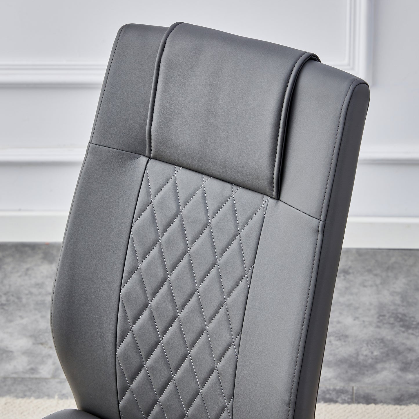Gray upholstered office chair with diamond stitching