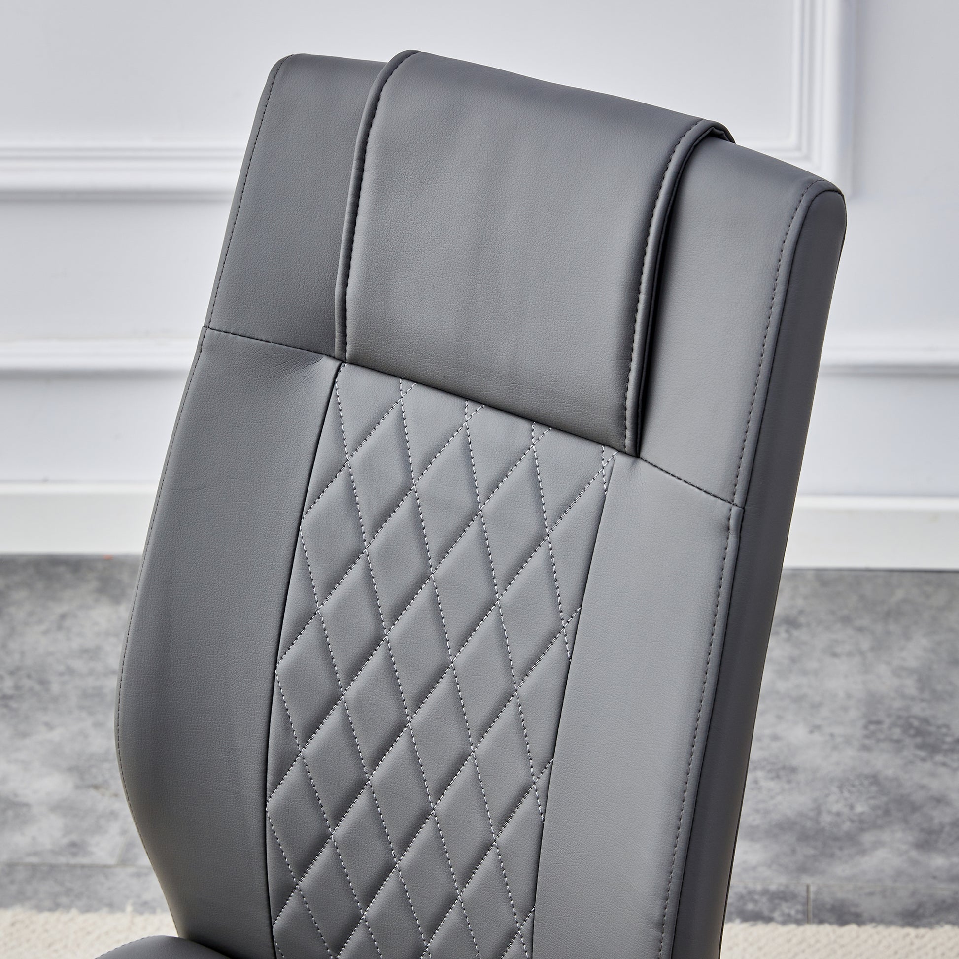 Gray upholstered office chair with diamond stitching