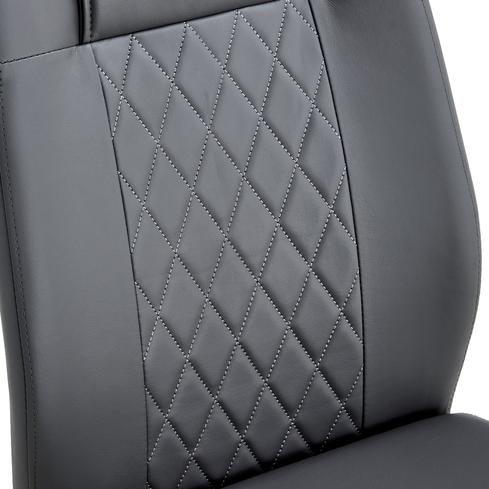 Closeup of grey faux leather car seat upholstery with diamond stitching