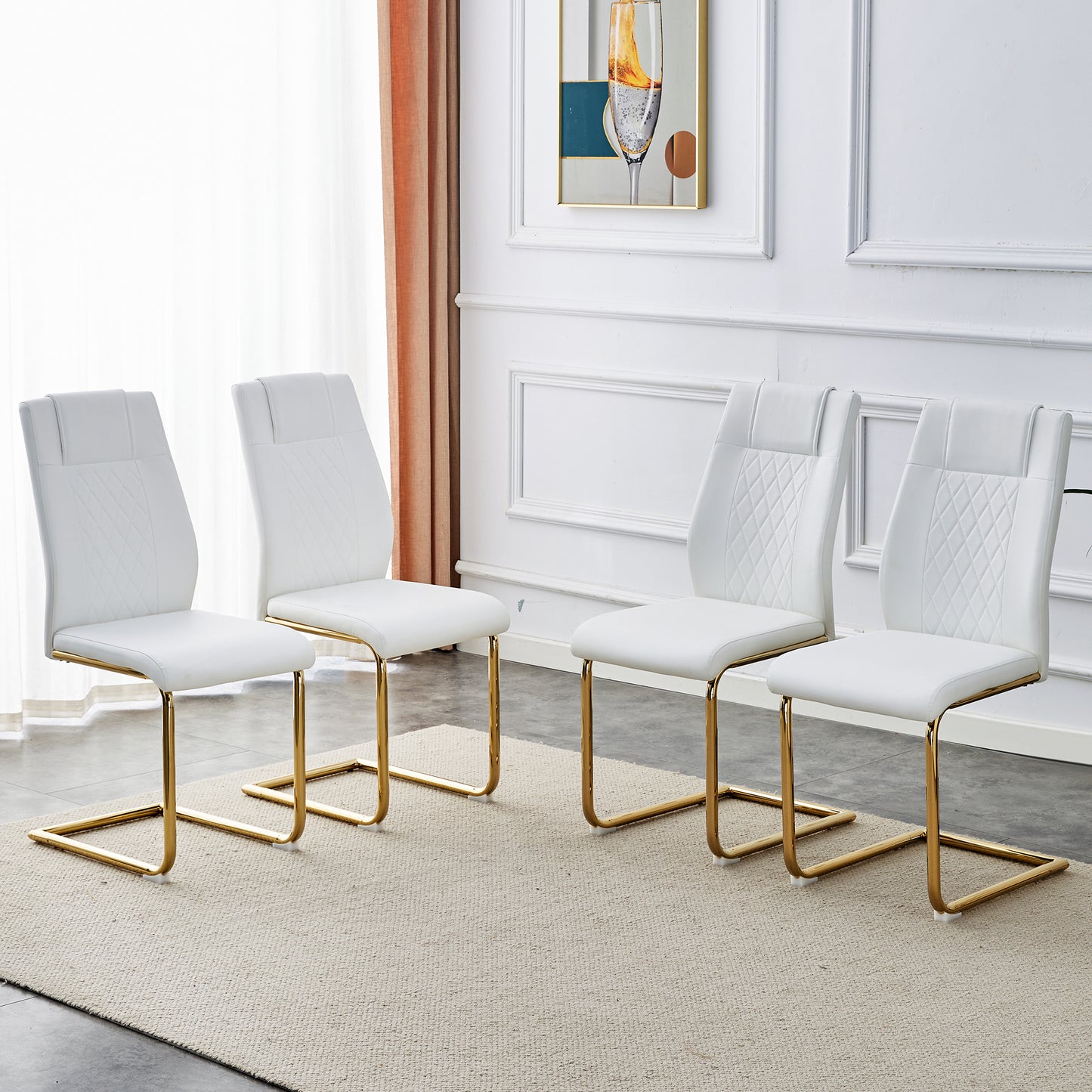 Set of  white faux leather dining chairs with diamond quilting and gold legs