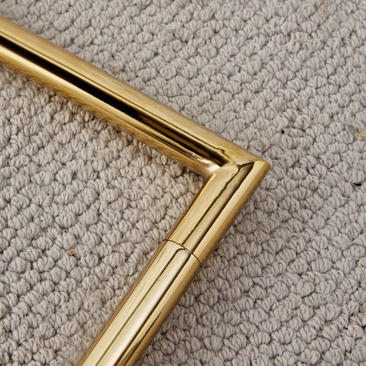 Polished brass furniture leg detail