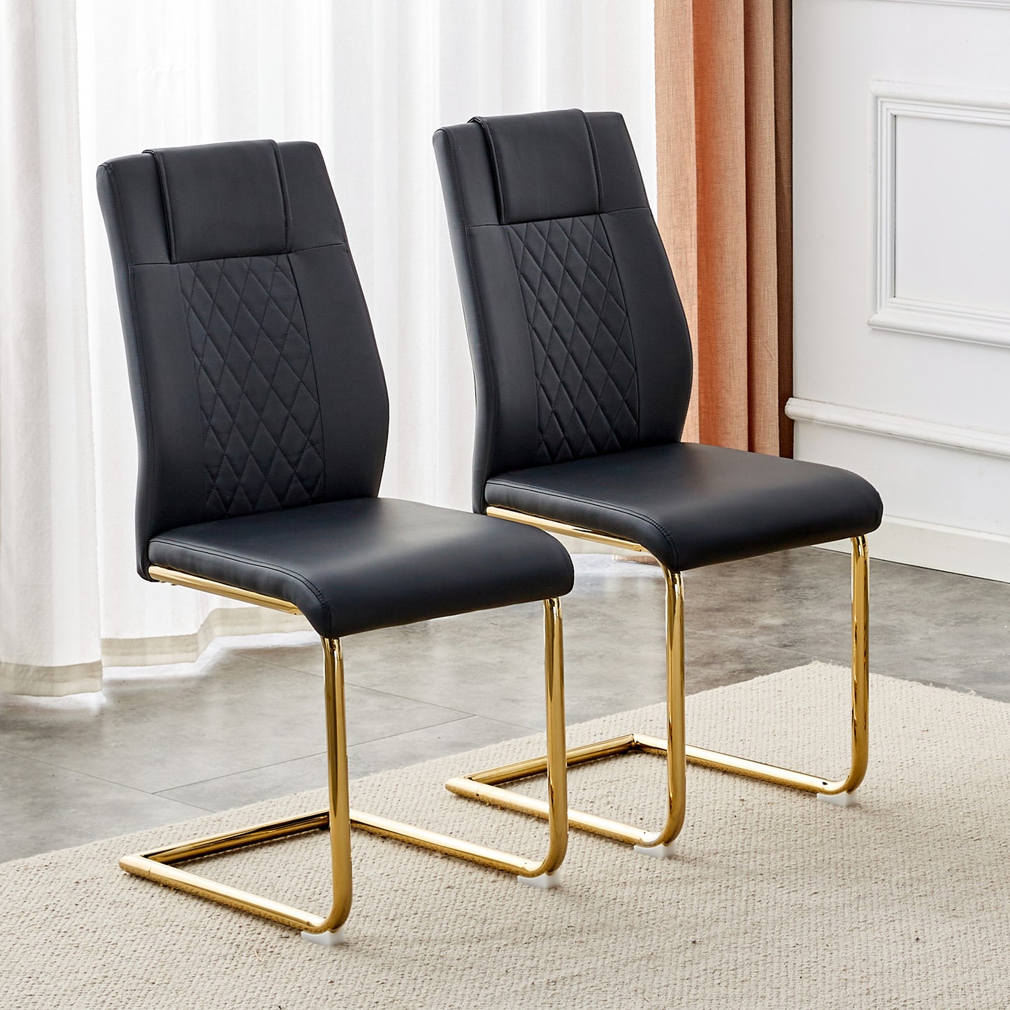 Black upholstered dining chairs with quilted diamond pattern and gold metal sled legs