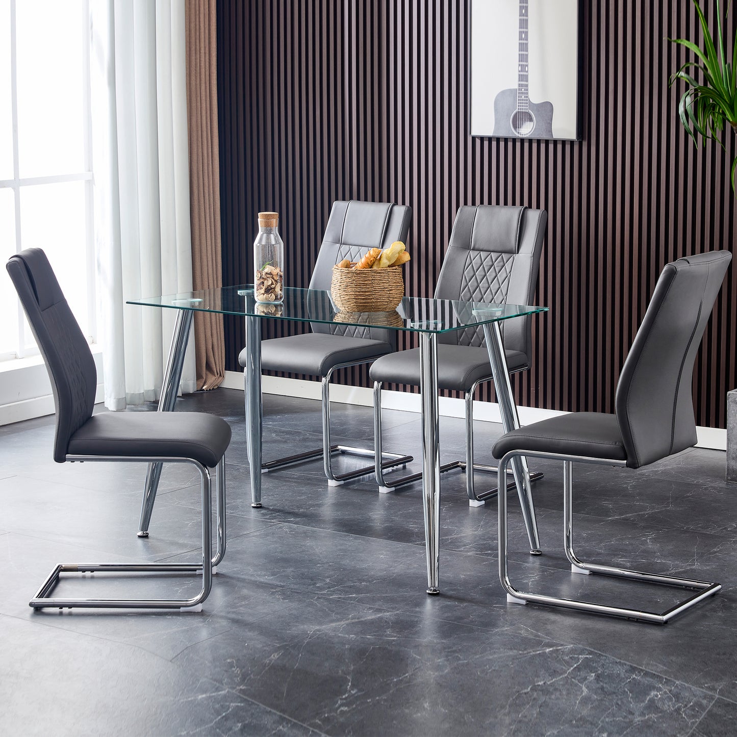 Modern dark gray dining chairs with quilted backrests and chrome cantilever legs