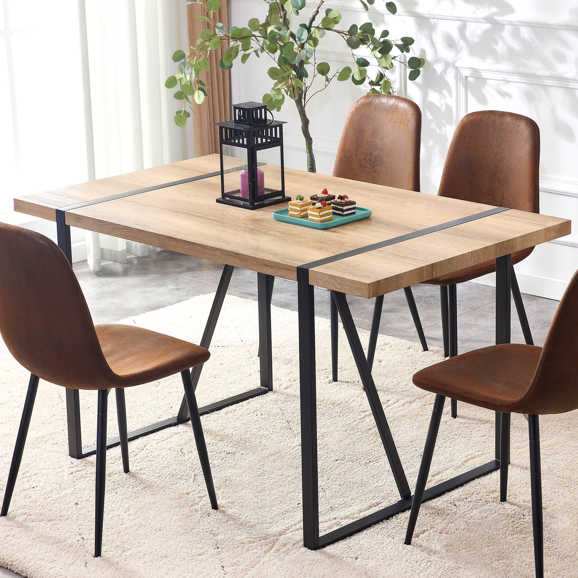 Oak dining table with black metal legs seats four guests comfortably