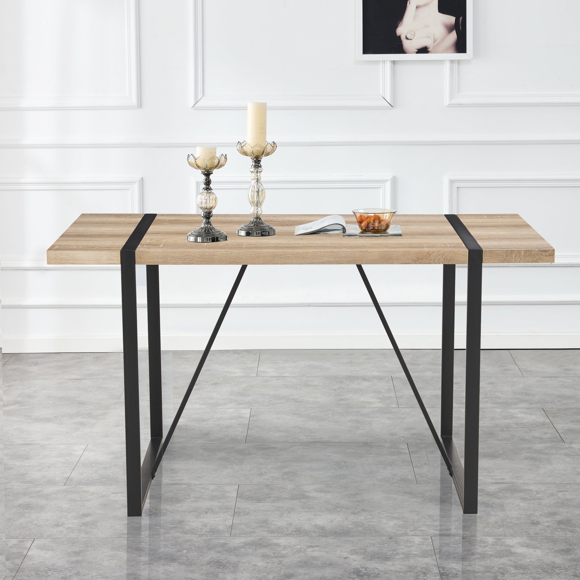 Modern oak dining table with black metal legs and inlaid detail