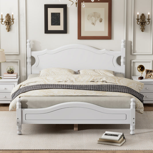 Elegant white wooden bed frame with ornate headboard and footboard for a sophisticated bedroom