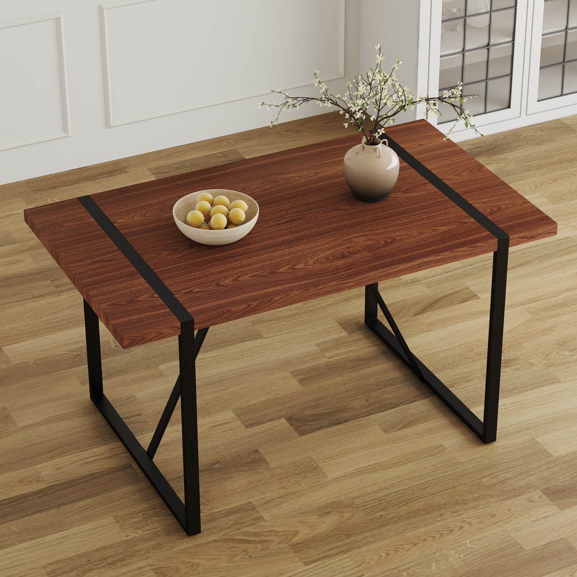 Modern walnut dining table with black metal legs and decorative inlay