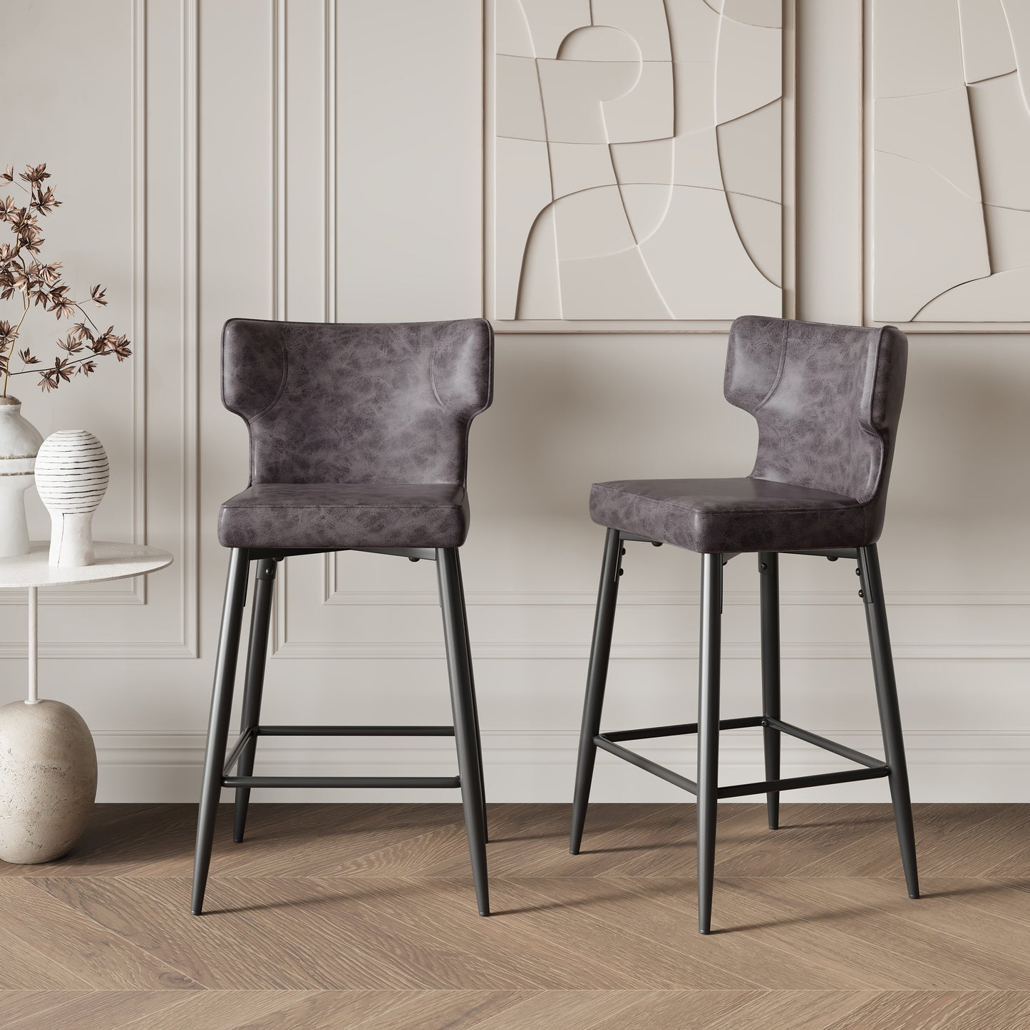 Dark grey faux leather bar stool with black metal legs and a curved back