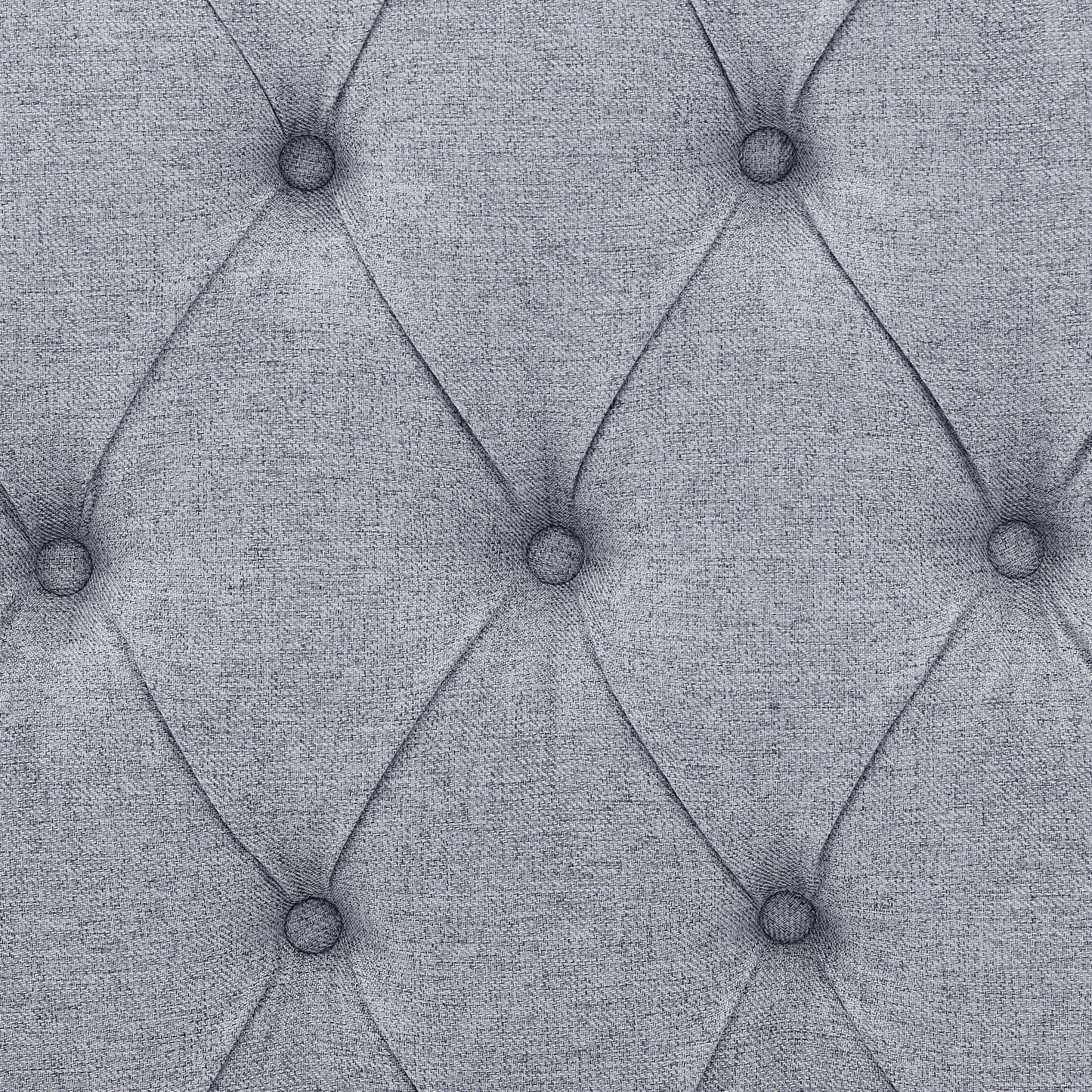 Closeup of grey textured fabric with diamond tufting ideal for upholstery