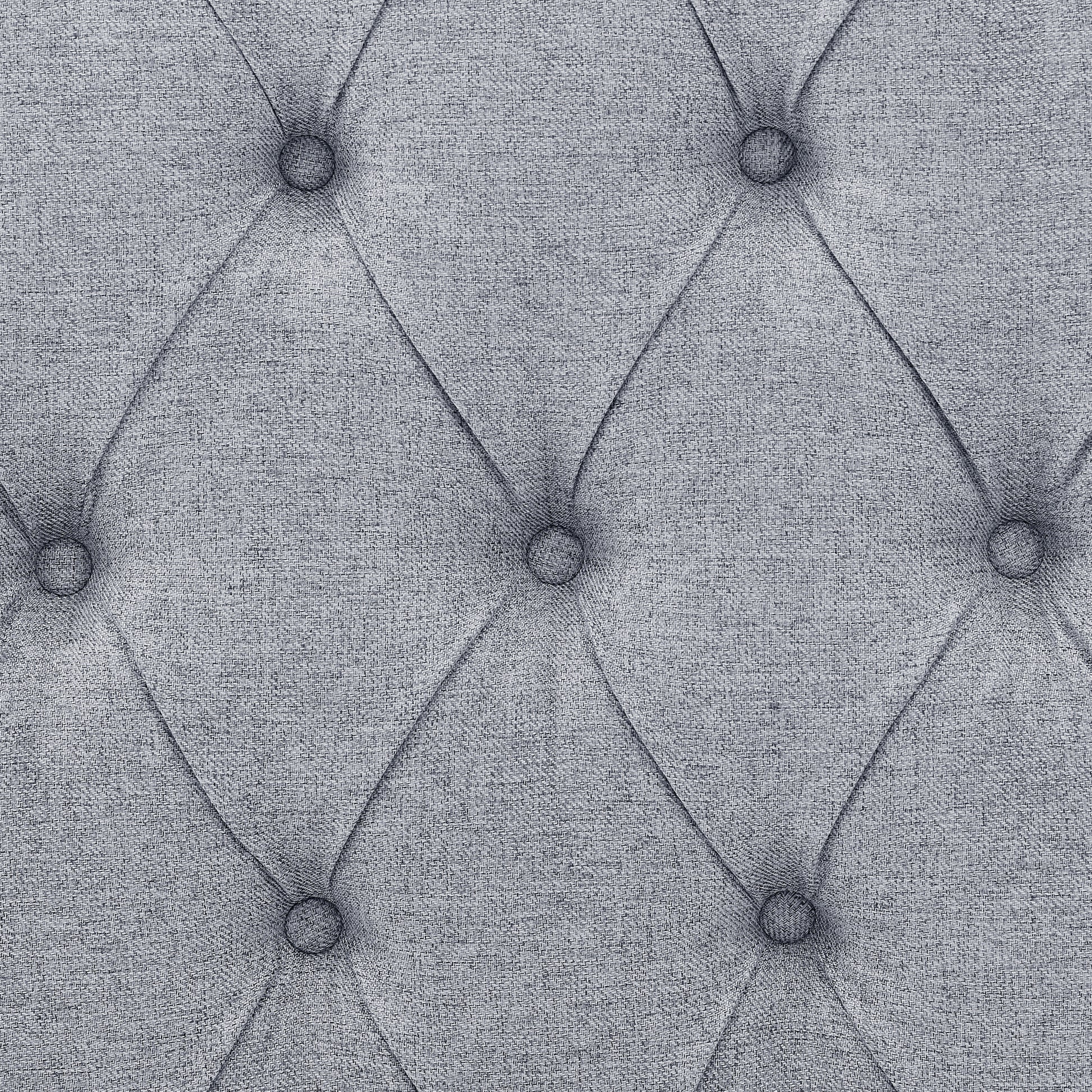 Closeup of grey textured fabric with diamond tufting ideal for upholstery