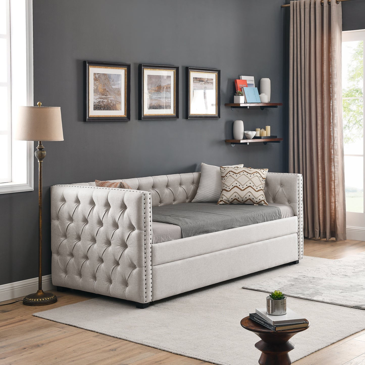 Elegant beige tufted daybed with studded trim perfect for living room seating
