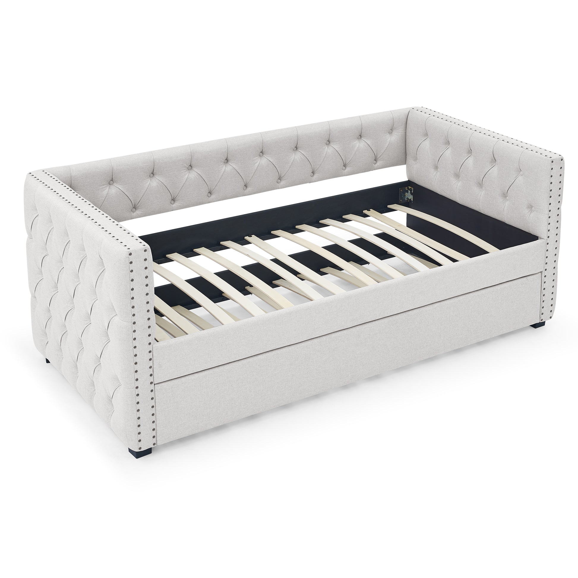 Tufted light grey upholstered daybed with nailhead trim and wooden slats perfect for guest rooms