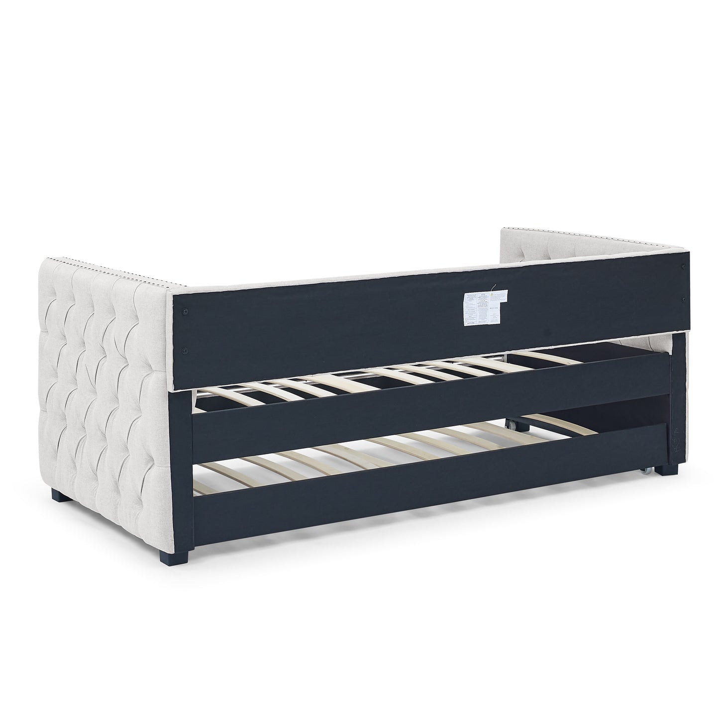 Tufted beige linen daybed with dark navy frame and wooden slats