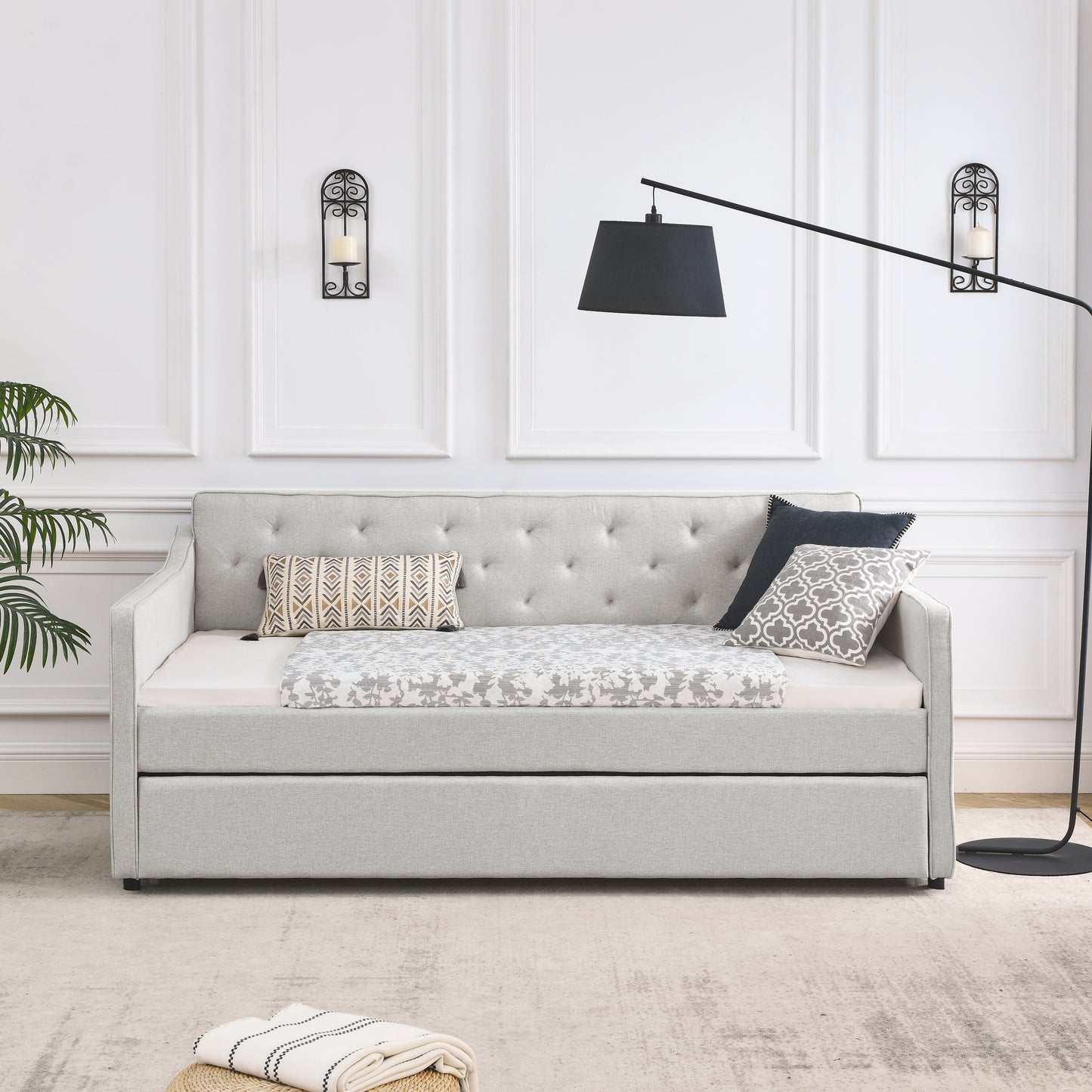 Tufted back light gray linen daybed with pullout trundle perfect for guest rooms