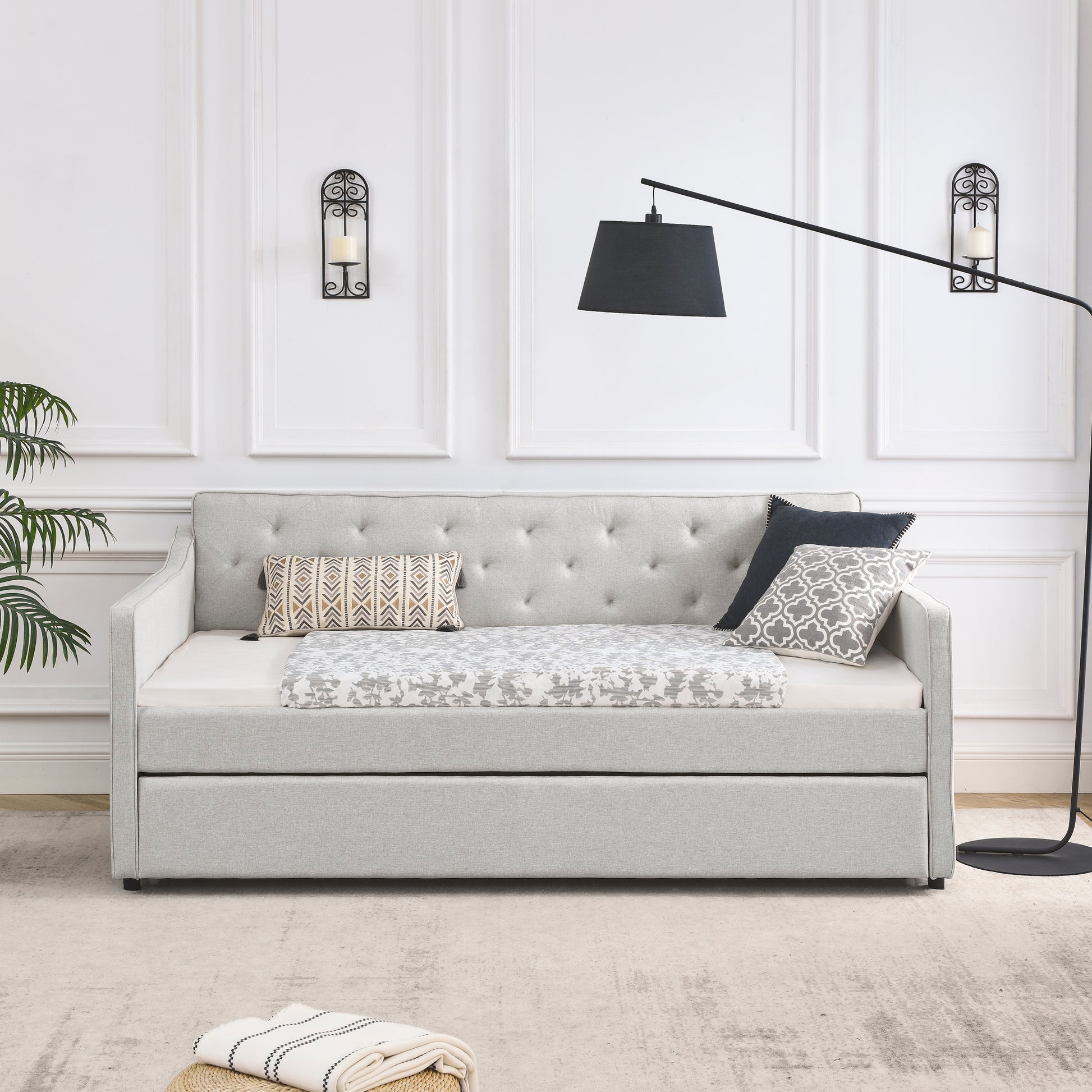 Tufted back light gray linen daybed with pullout trundle perfect for guest rooms