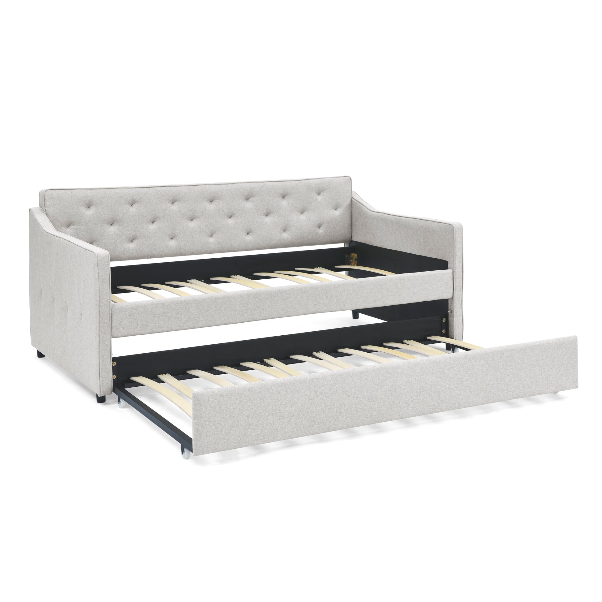 Light gray upholstered daybed with trundle and diamond tufting on backrest