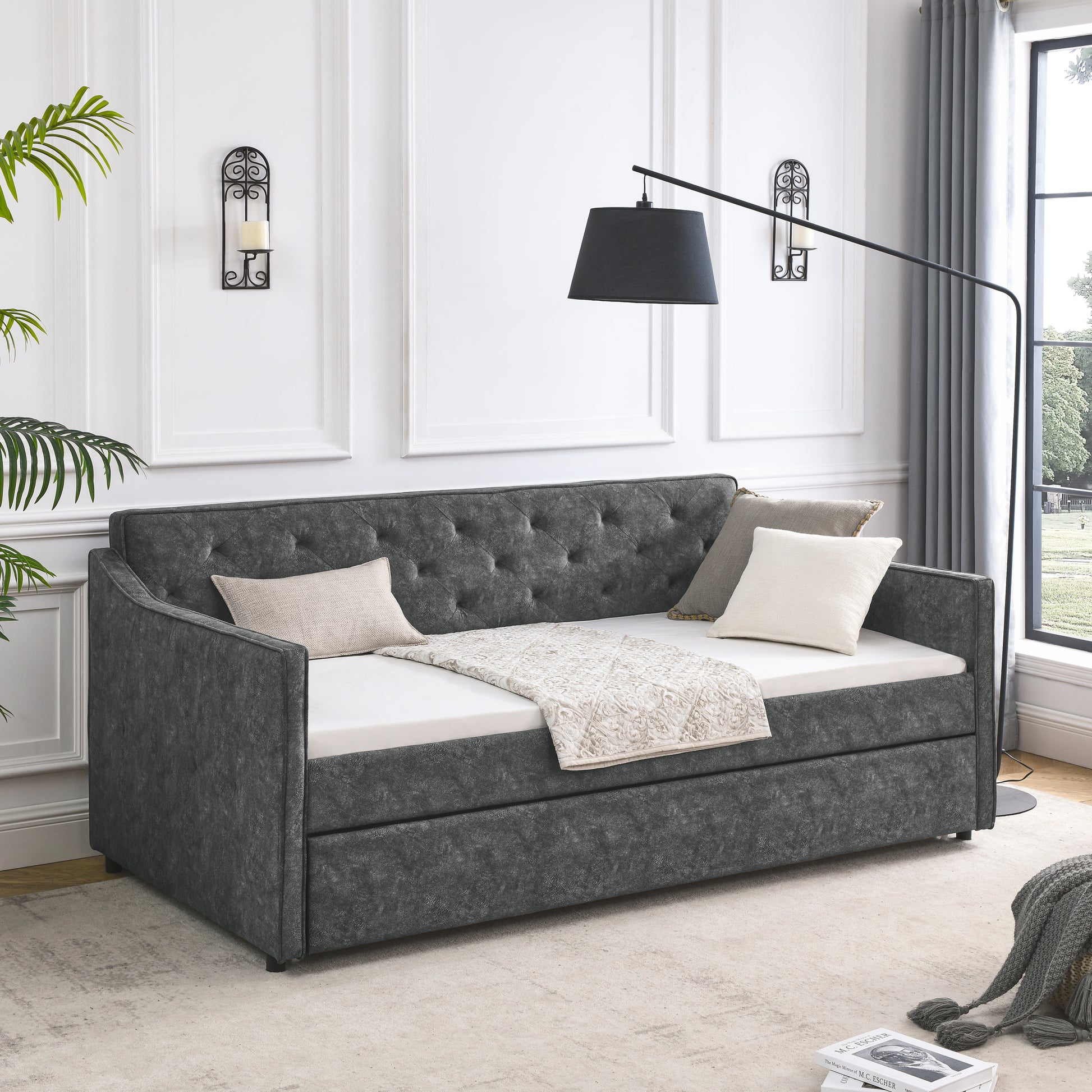 Dark grey tufted daybed with mattress and decorative pillows modern living room furniture