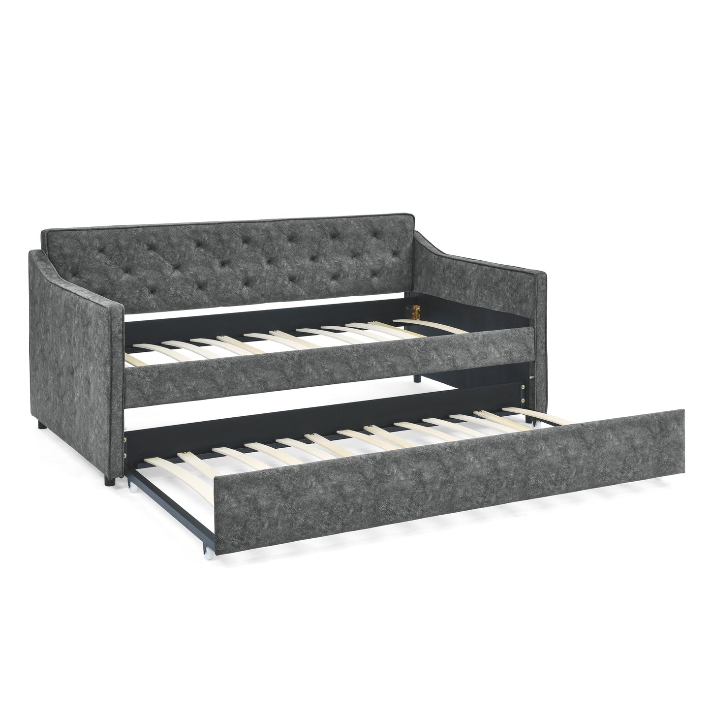 Dark gray tufted upholstered daybed with pullout trundle bed