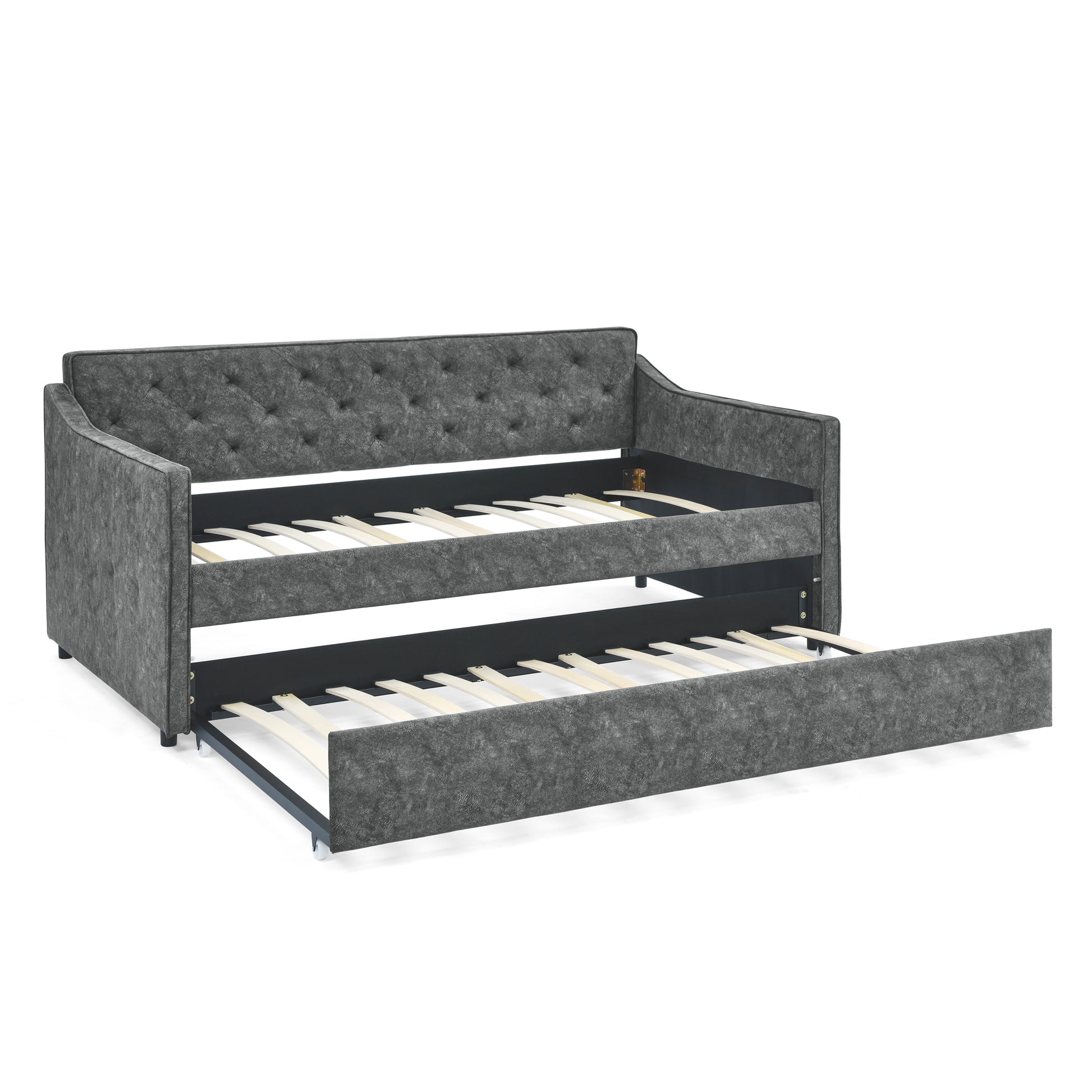 Dark gray tufted upholstered daybed with pullout trundle bed