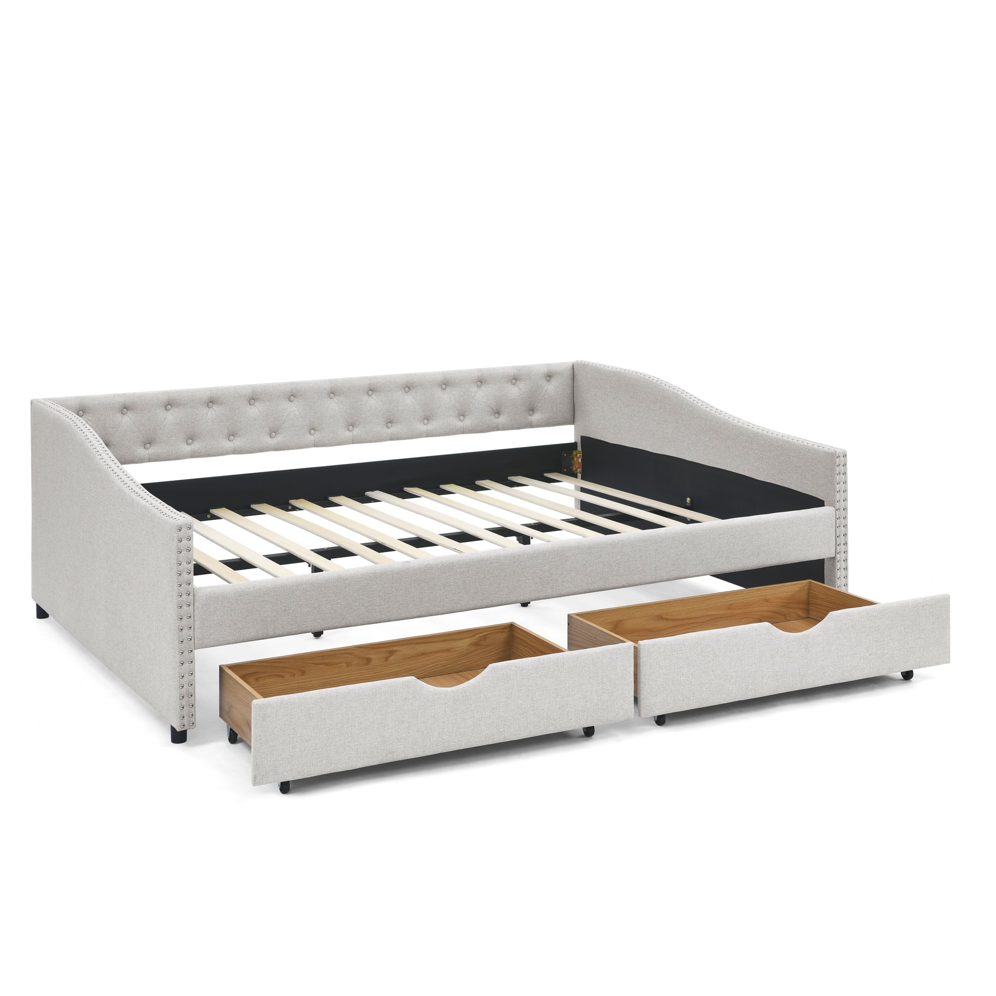 Light gray upholstered daybed with tufted back and two pullout storage drawers