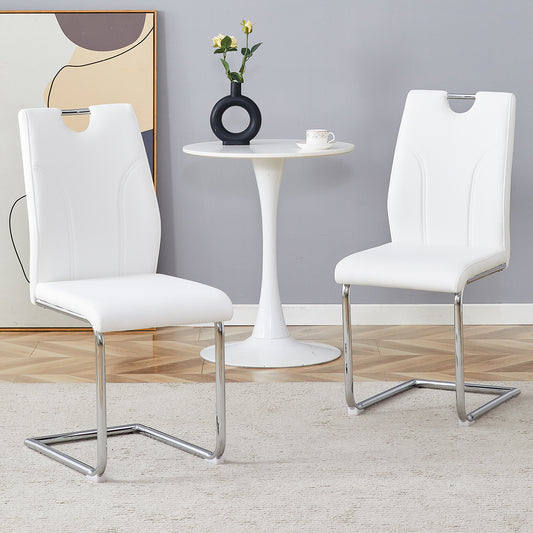 White faux leather dining chairs with chrome sled legs