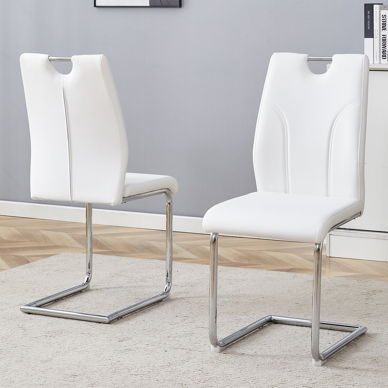 White faux leather dining chair with chrome cantilever base