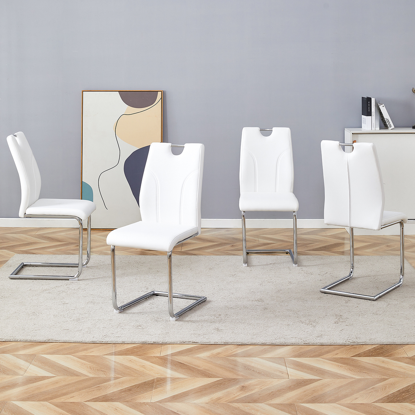 White faux leather dining chairs with chrome sled legs