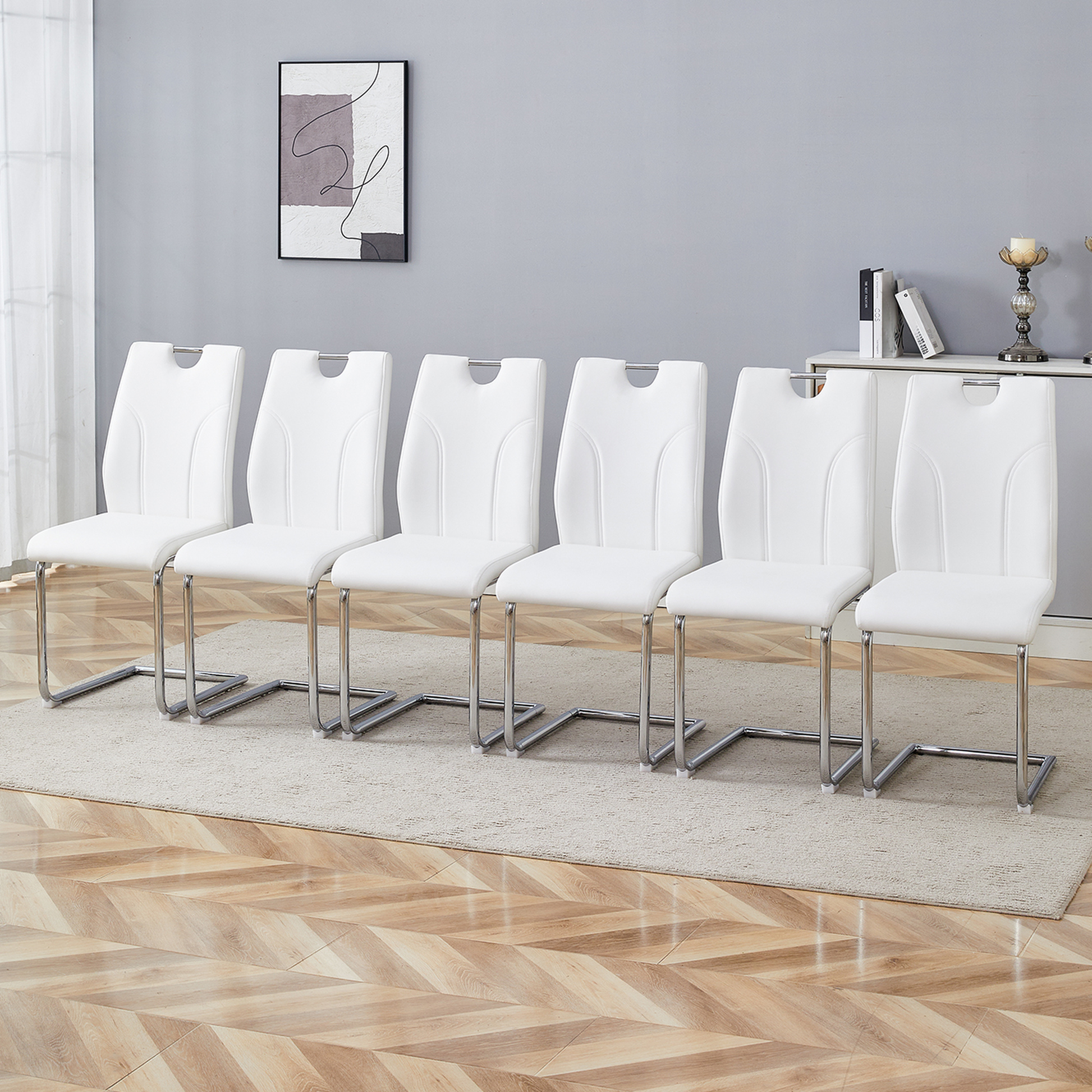 Set of  white faux leather dining chairs with chrome sled legs
