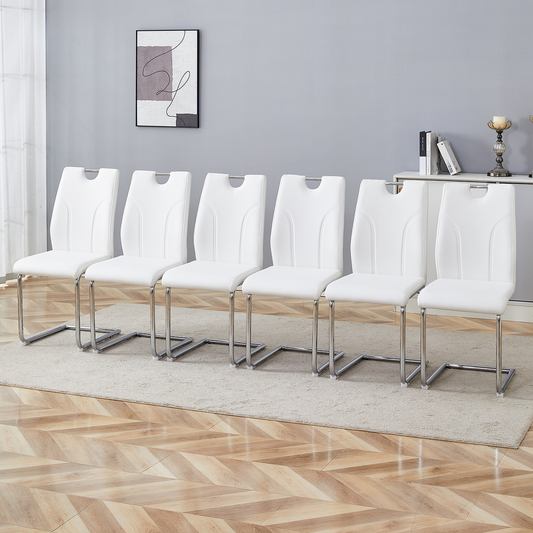 Set of  white faux leather dining chairs with chrome sled legs