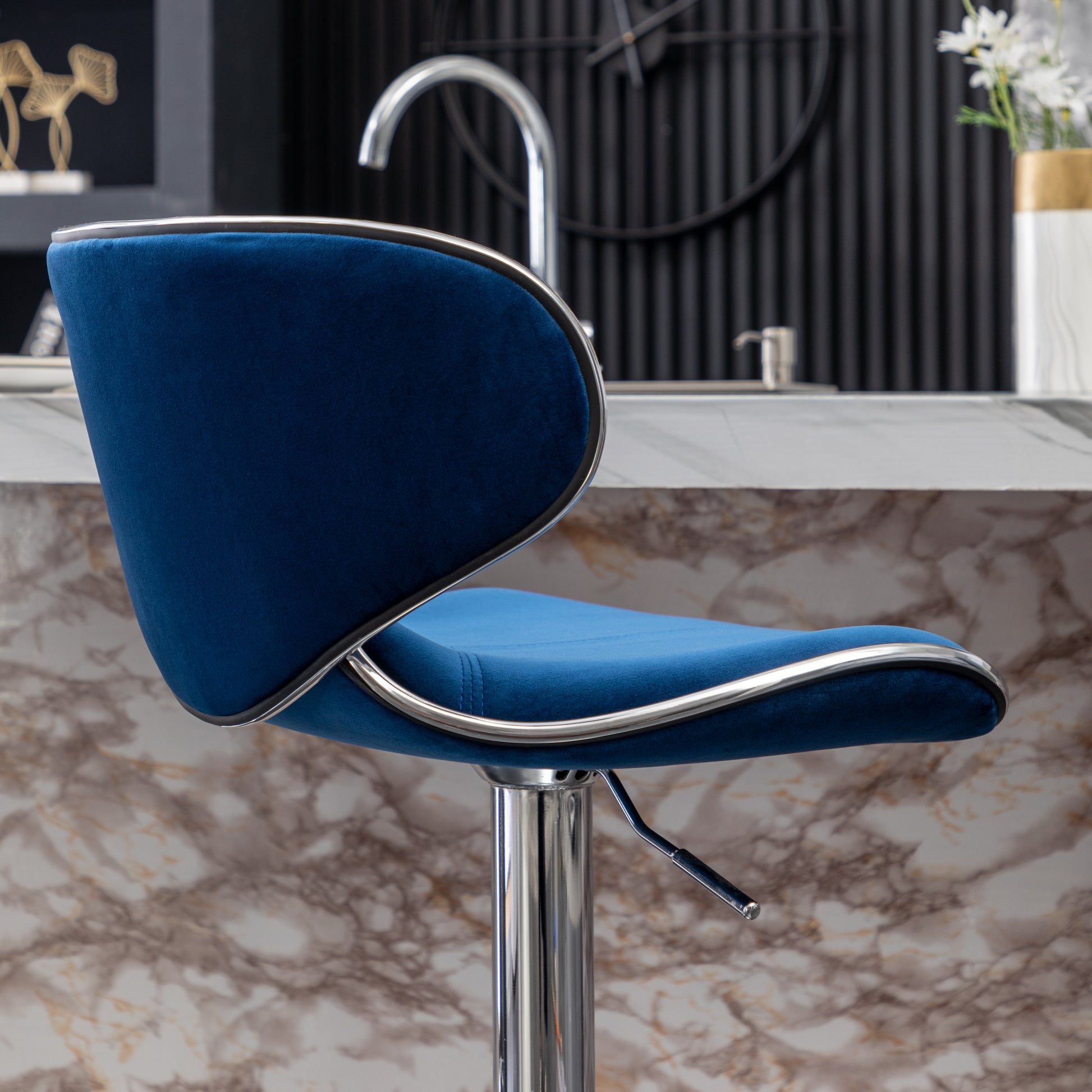 Adjustable navy blue velvet bar stool with chrome accents