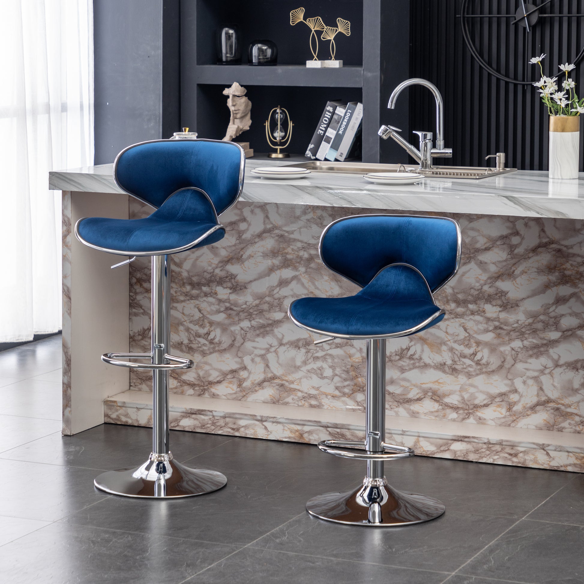 Plush navy blue velvet bar stool with chrome accents and adjustable height