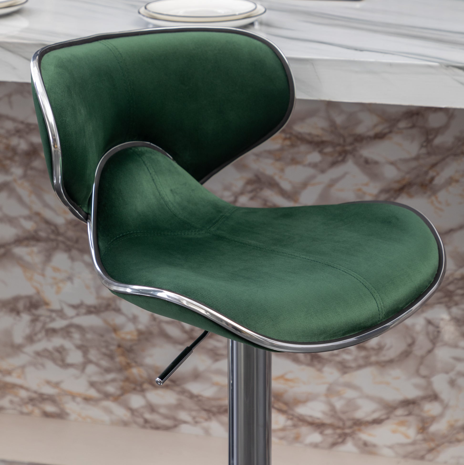 Emerald green velvet bar stool with chrome trim