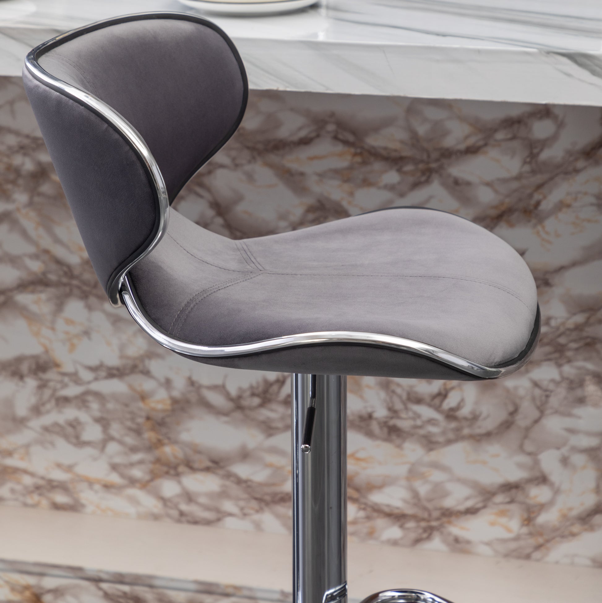 Gray velvet bar stool with chrome trim
