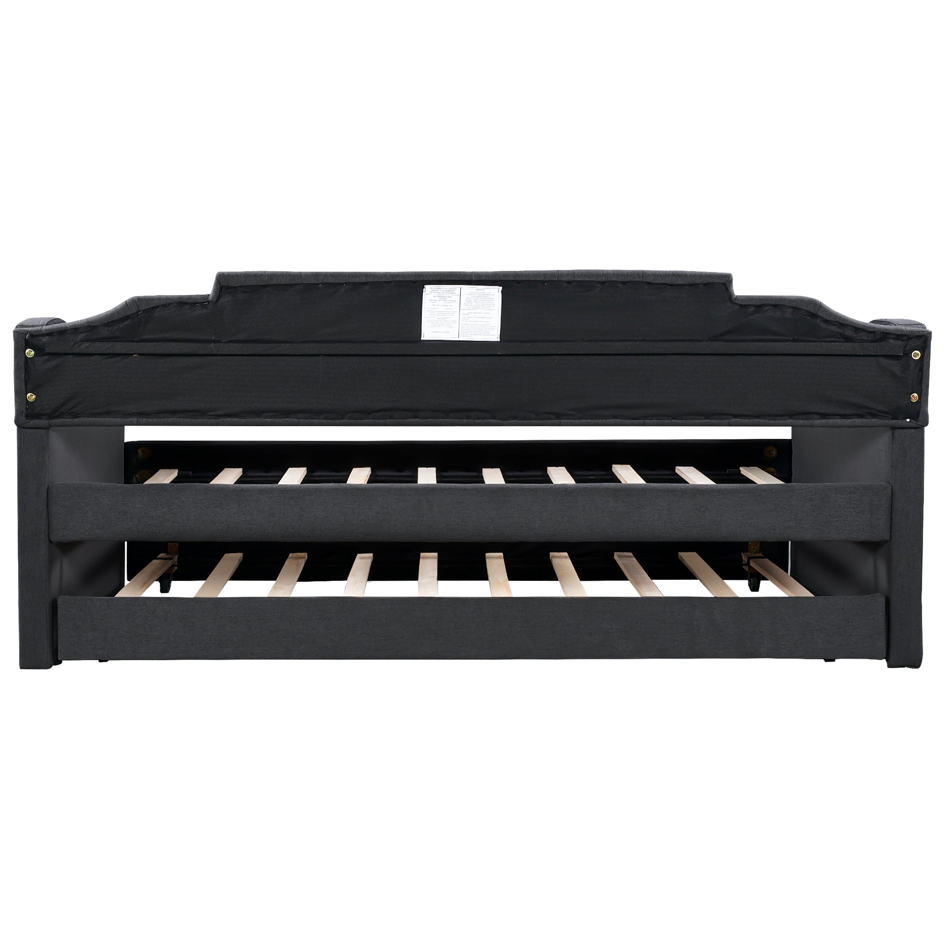 Dark grey upholstered daybed frame with visible wooden slats for mattress support