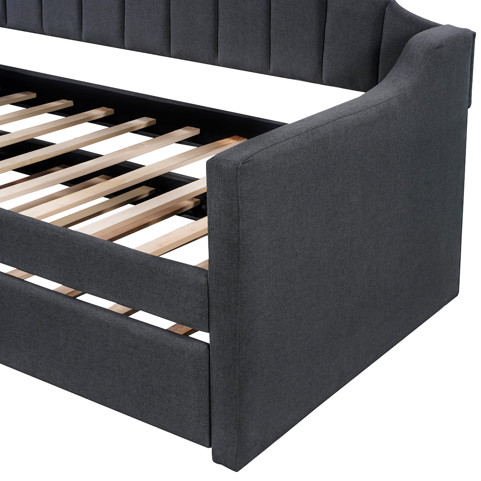 Dark grey upholstered twin daybed with channeled headboard and slatted base for bedroom comfort