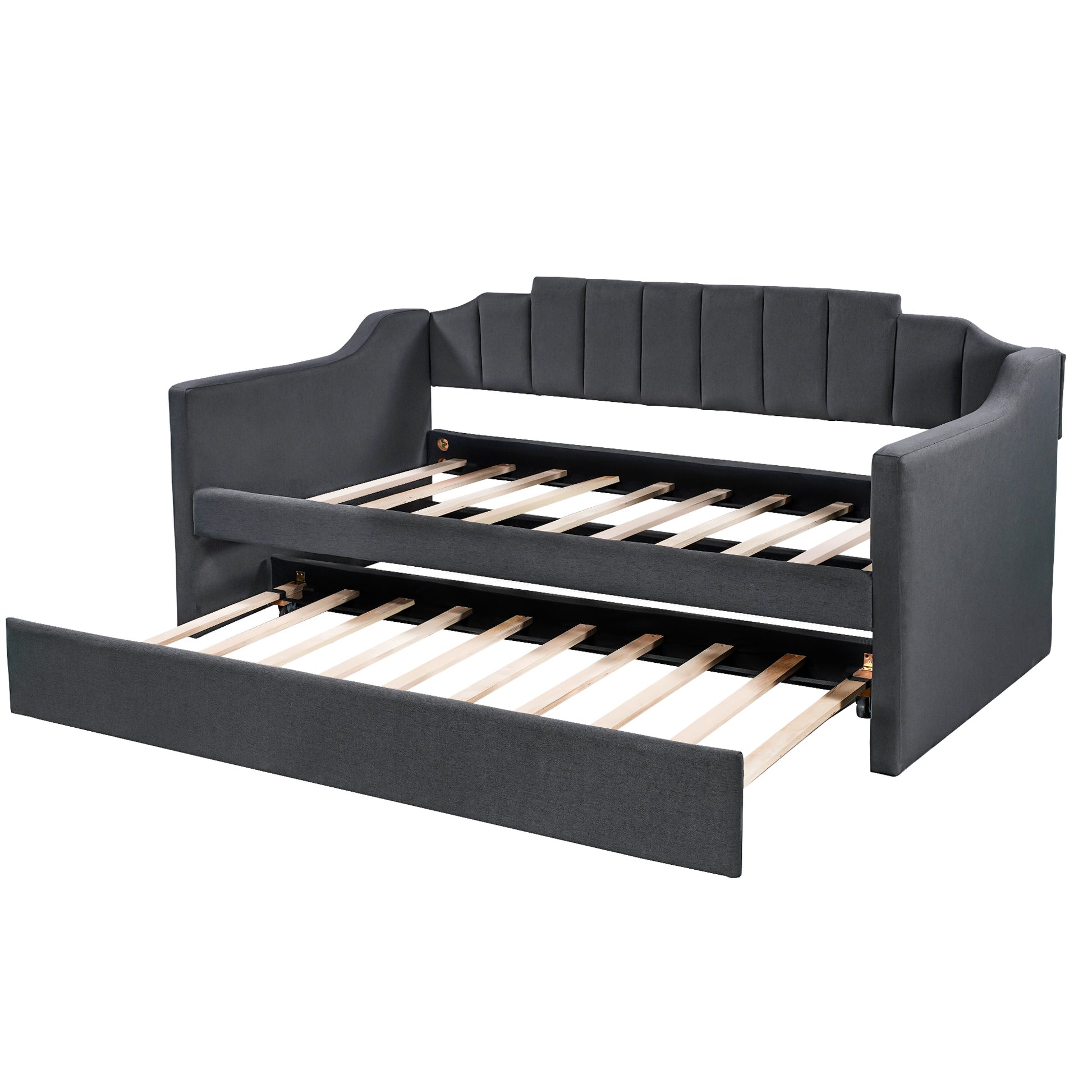 Dark grey upholstered daybed with pullout trundle and slatted wood frame