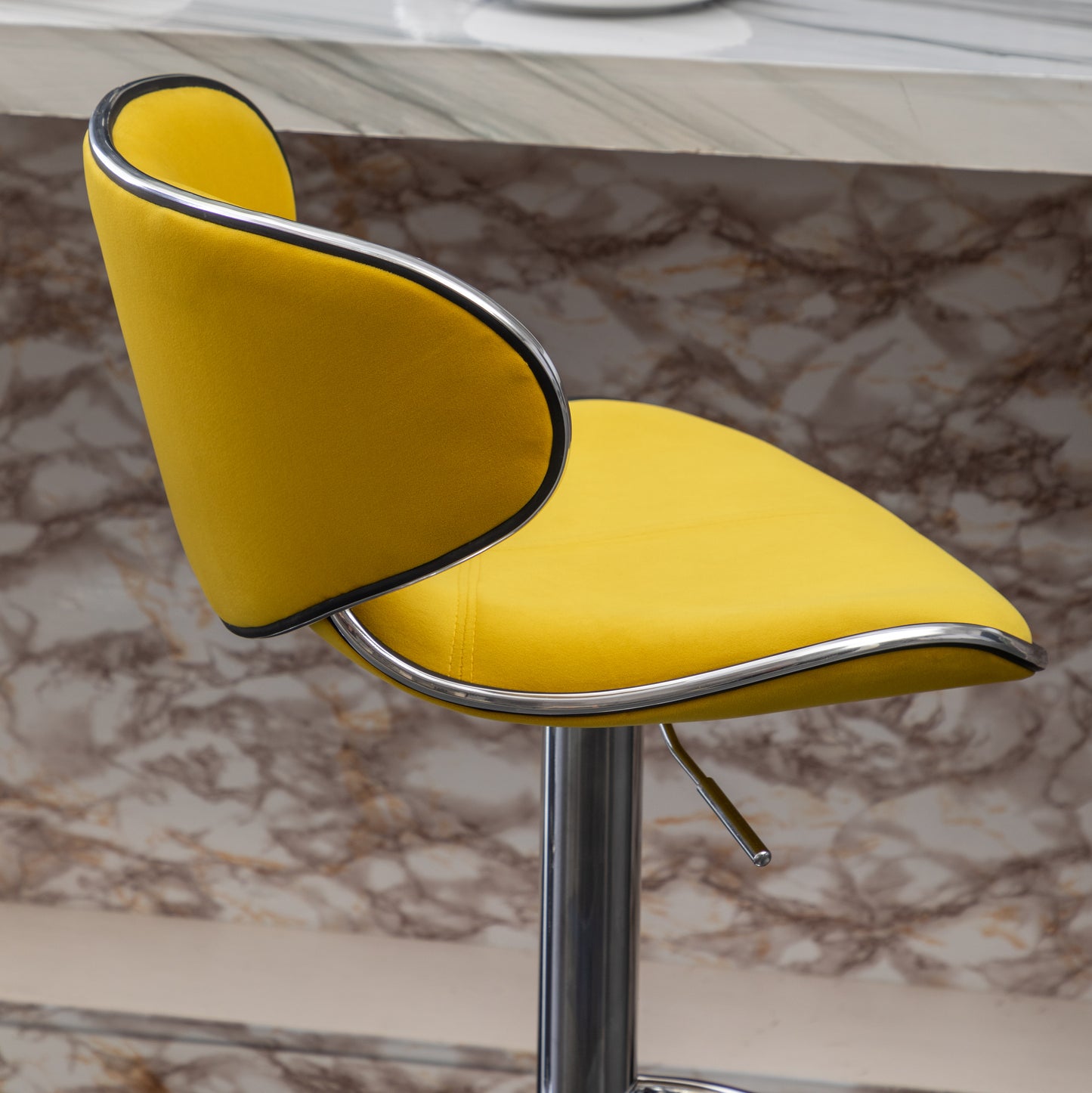 Yellow velvet bar stool with chrome accents
