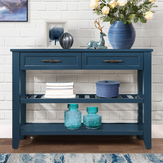 Deep blue console table with two drawers and open shelving housing decorative items