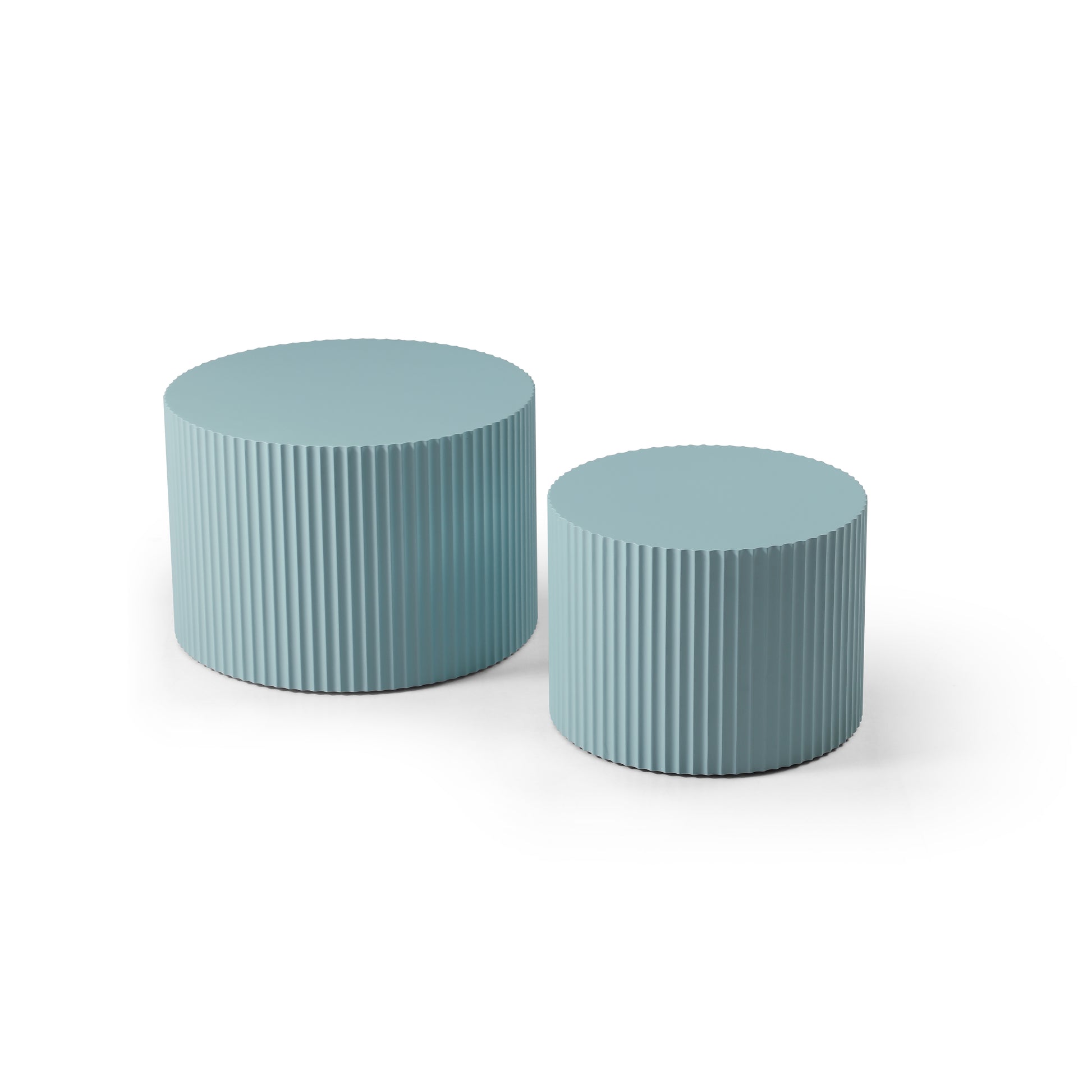 Two ribbed blue cylindrical side tables on a white background