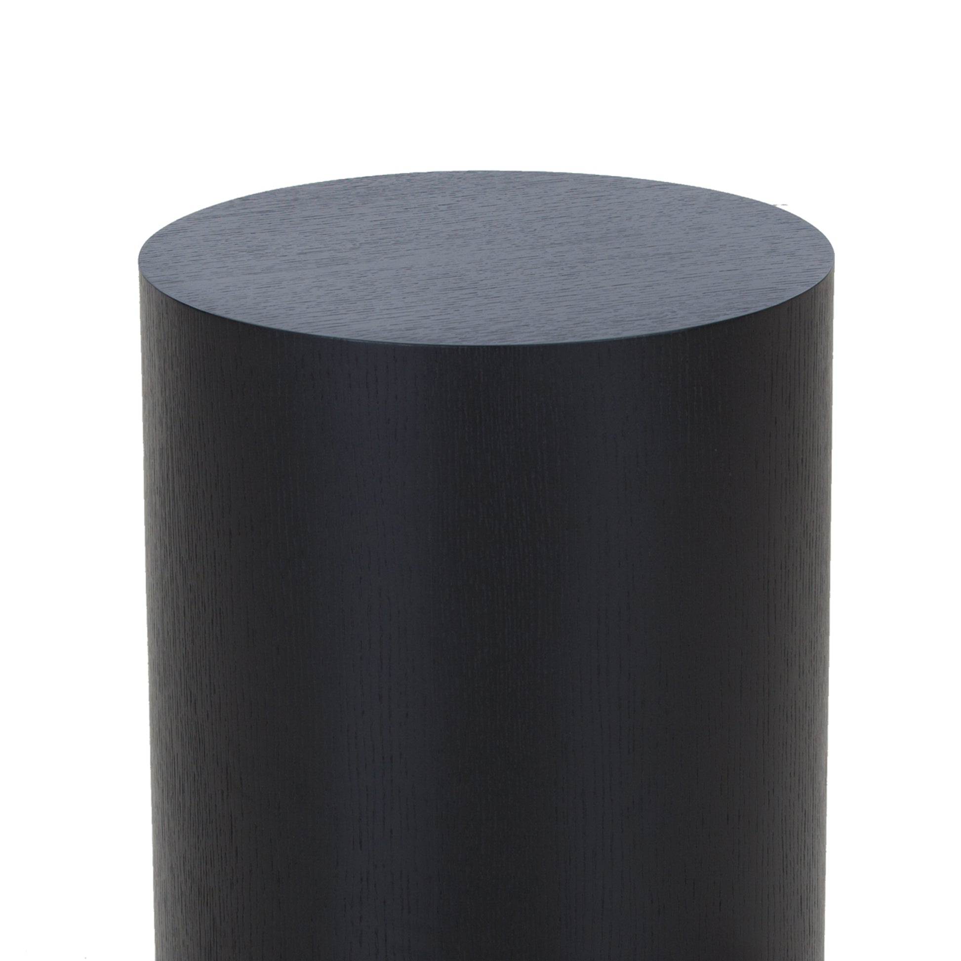 Dark grey cylindrical wood stool with subtle grain texture