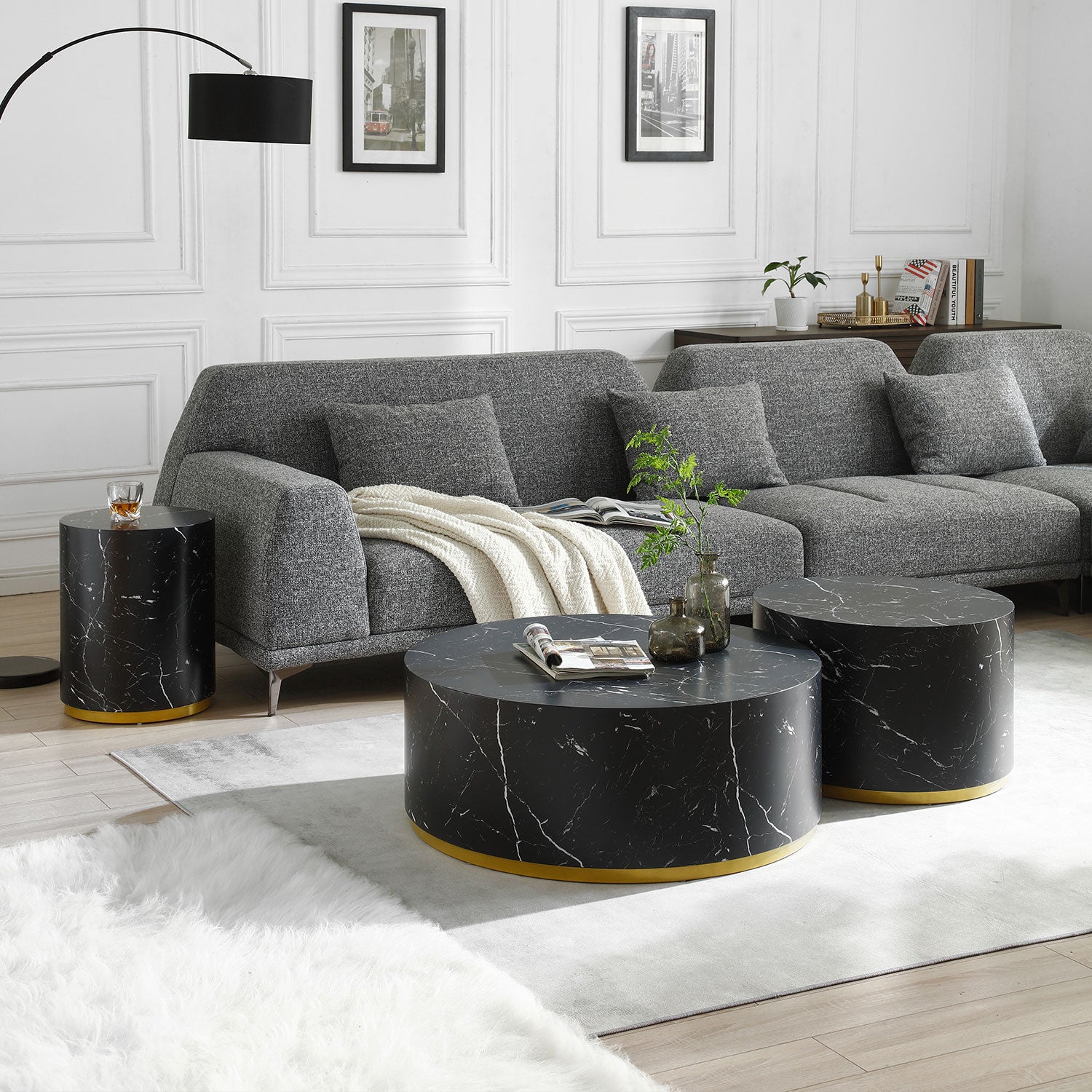 Round marble coffee table with a gold base ideal for modern living rooms