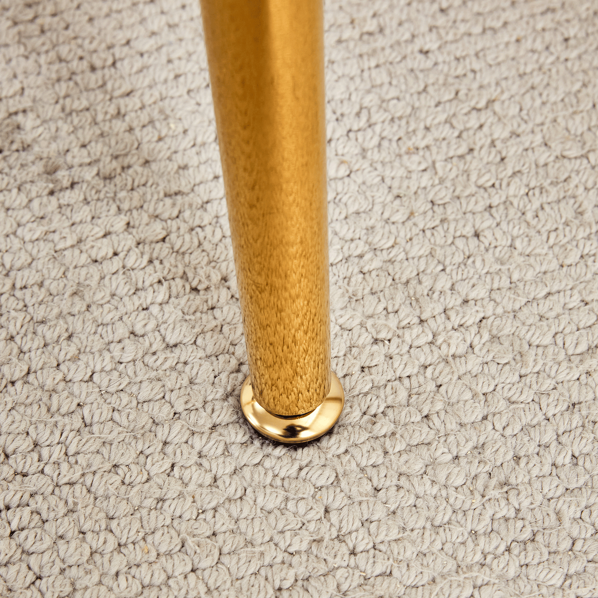 Golden metal furniture leg with polished finish