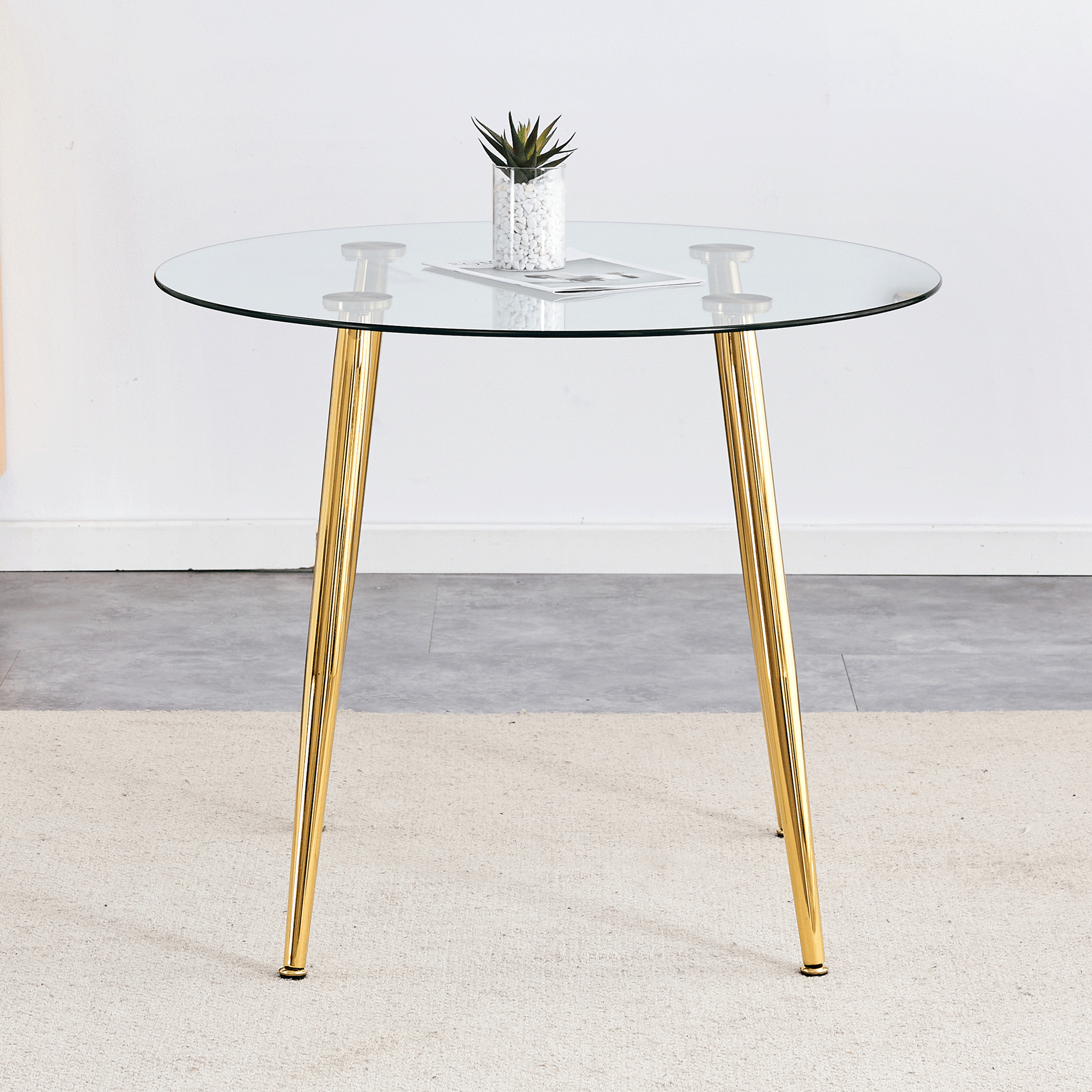 Round glass dining table with gold metal legs