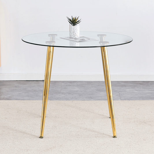 Round glass dining table with gold metal legs