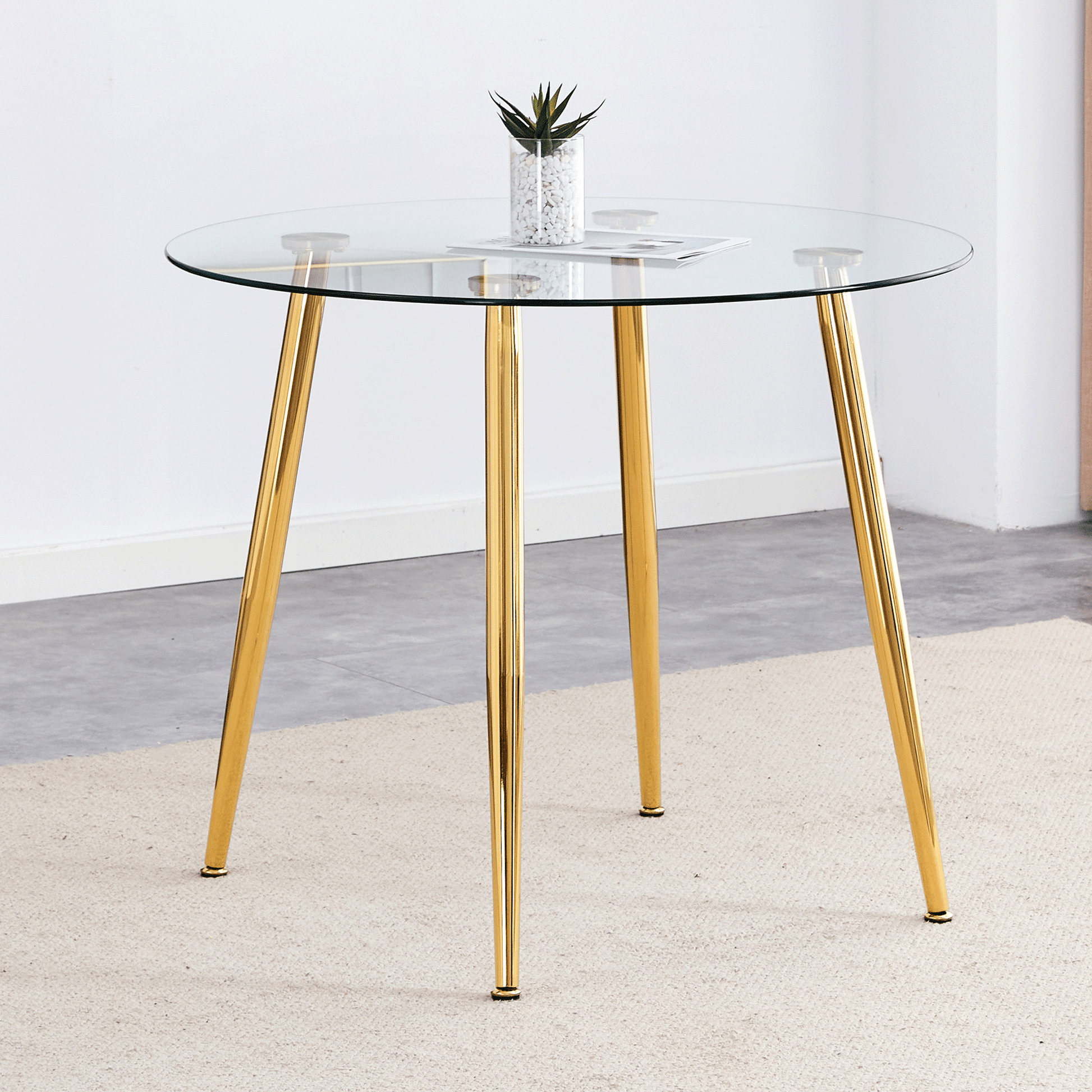 Round glass dining table with gold legs