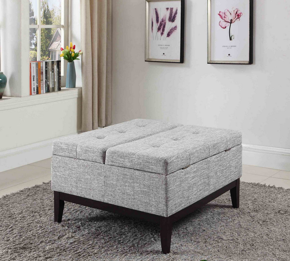 Tufted grey fabric storage ottoman with dark wood legs provides stylish seating
