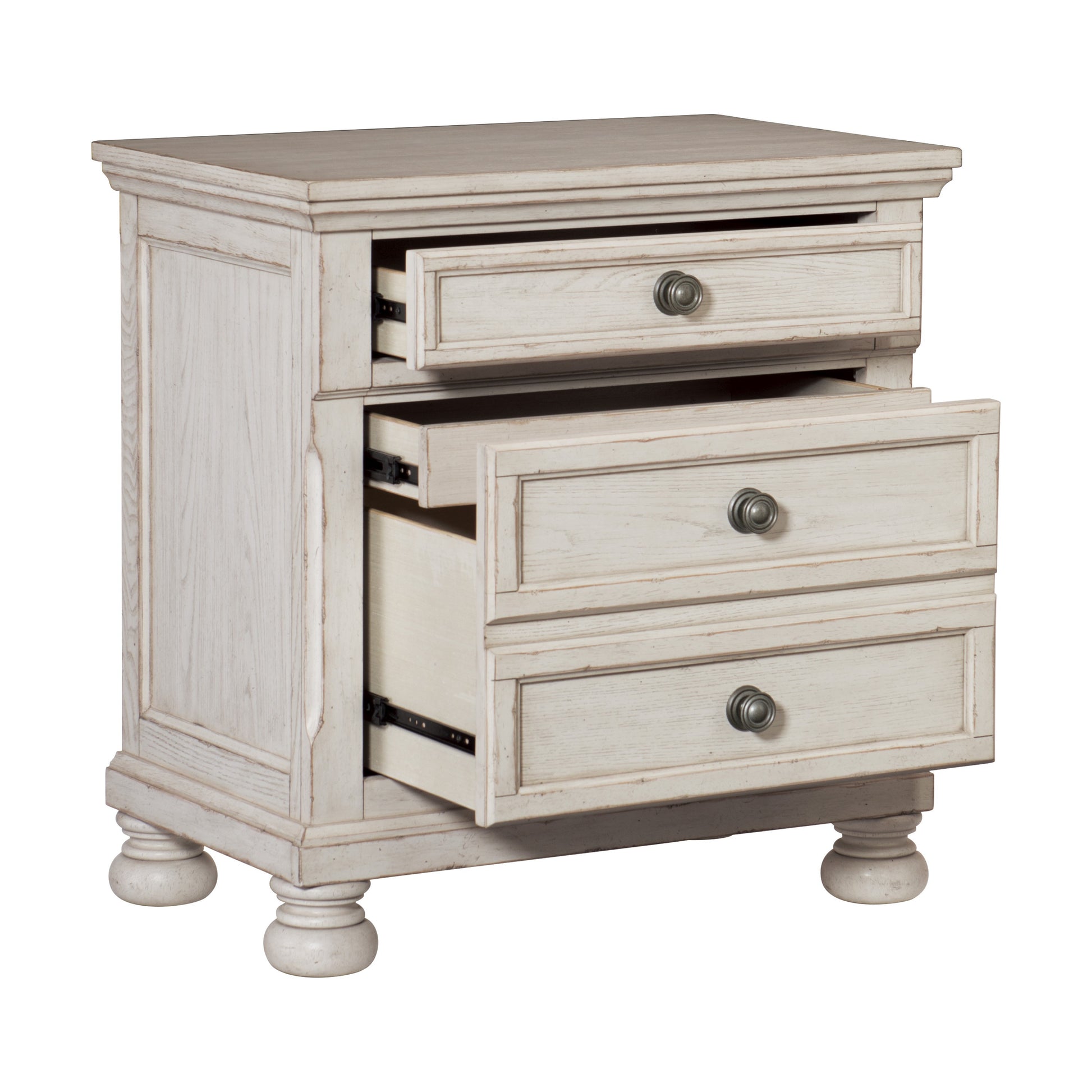Whitewashed wood nightstand with three drawers and antique brass knobs