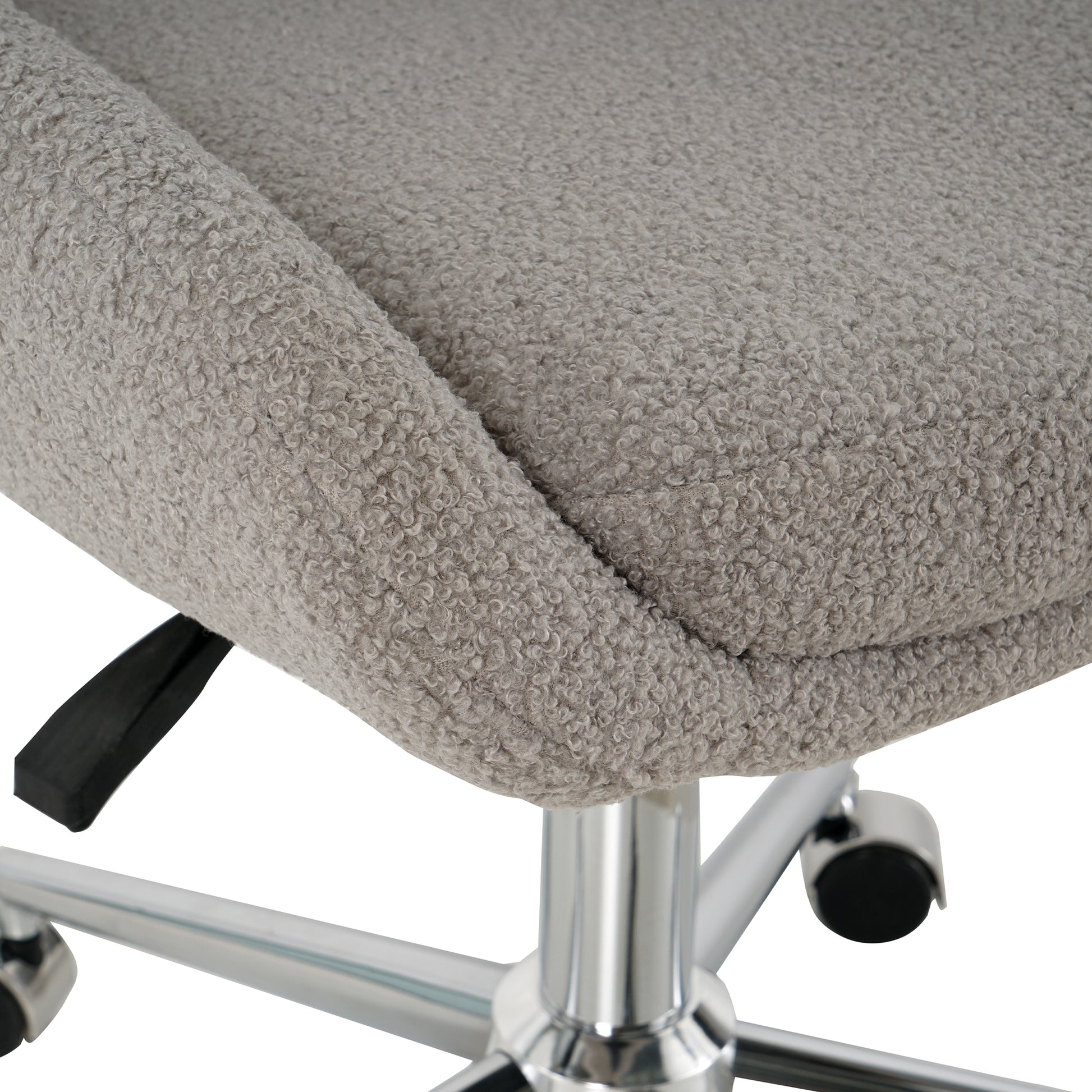 Closeup of a comfortable grey teddy fleece office chair seat
